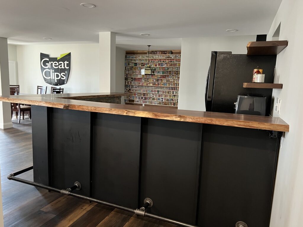 Beautiful bar with live-edge wood top in Linglestown, PA Basement Remodel from GP Harris