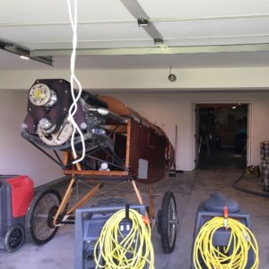 Airplane without wings inside of custom garage.