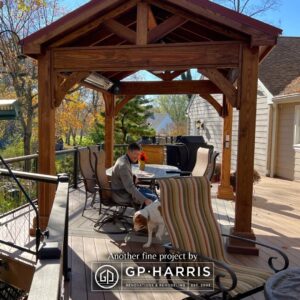 Gazebo with a lot of comfortable seating & bird feeders.